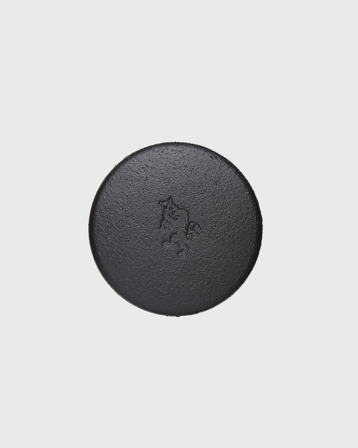 Black cast iron 2-part spice grinder with internal teeth for crushing herbs and spices