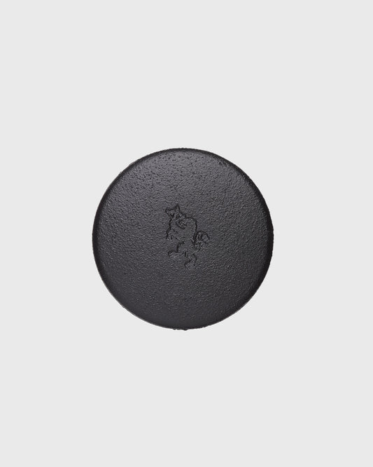 Black cast iron 2-part spice grinder with internal teeth for crushing herbs and spices