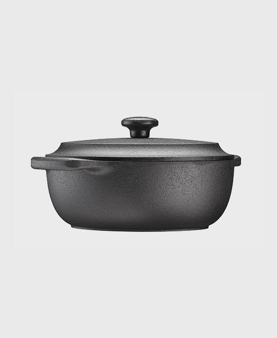 Black cast iron casserole 2 L oval with iron lid and two iron handles