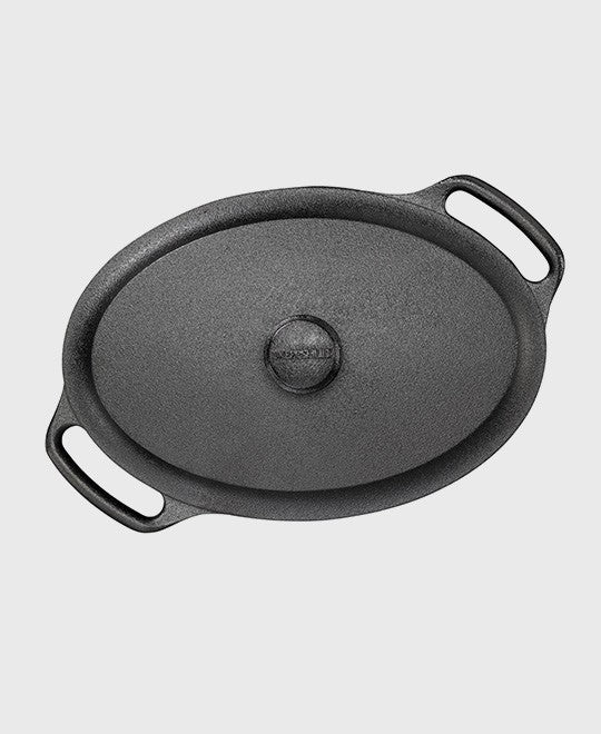 Black cast iron casserole 4 L oval with iron lid and two iron handles