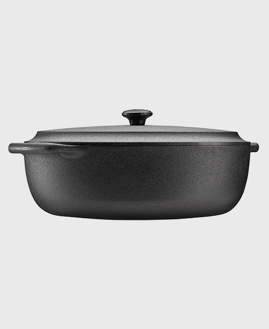 Black cast iron casserole 6 L oval with iron lid and two iron handles