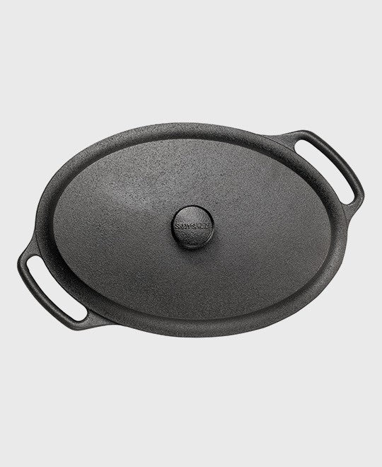 Black cast iron casserole 6 L oval with iron lid and two iron handles