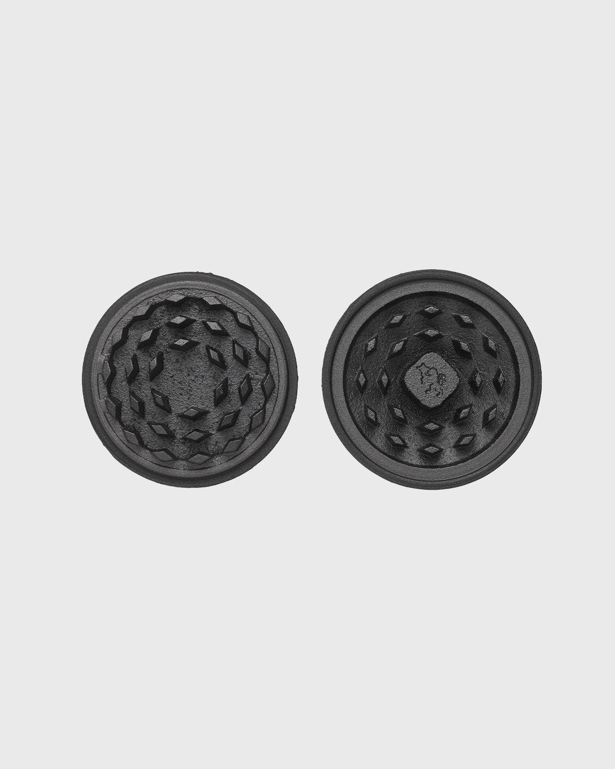 Black cast iron 2-part spice grinder with internal teeth for crushing herbs and spices