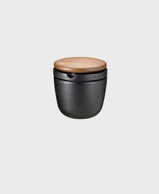 Black cast iron spice mill swing and storage jar with walnut wood lid, ideal for pepper and dry herbs
