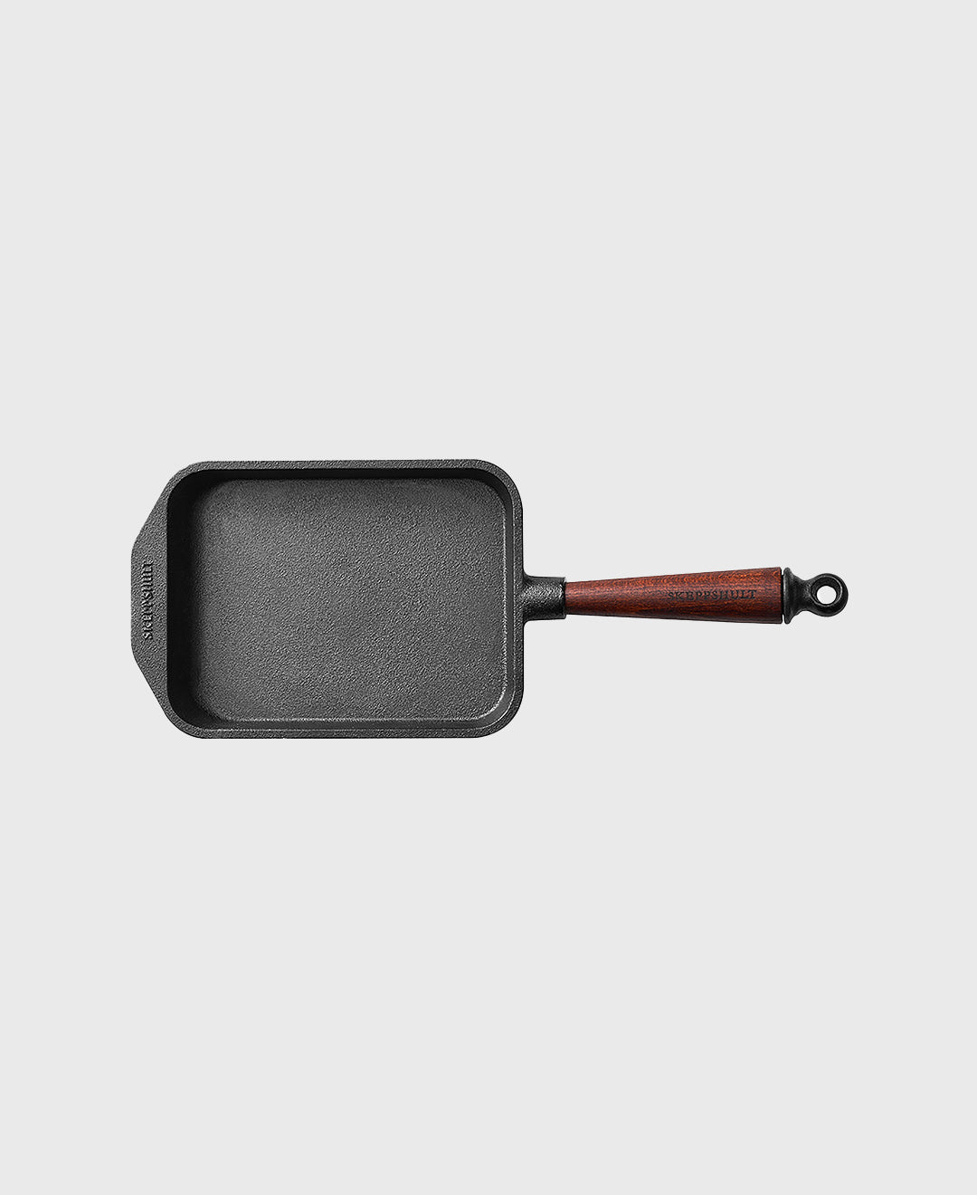 Black cast iron tamagoyaki rectangular frying pan with beechwood handle
